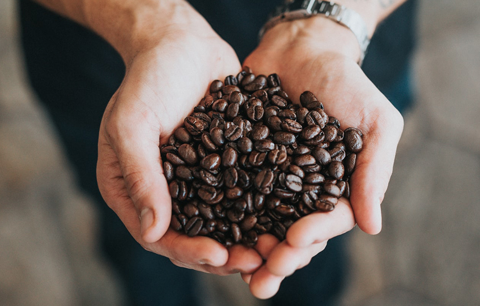 man holding coffee beans